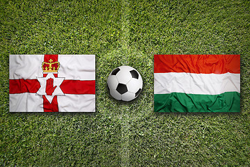 Image showing Northern Ireland vs. Hungary flags on soccer field