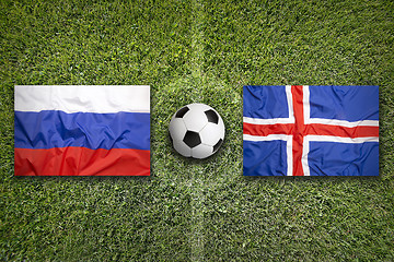 Image showing Russia vs. Iceland flags on soccer field