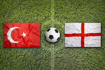 Image showing Turkey vs. England flags on soccer field