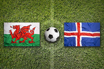 Image showing Wales vs. Iceland flags on soccer field