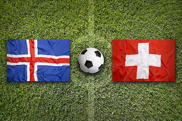 Image showing Iceland vs. Switzerland flags on soccer field