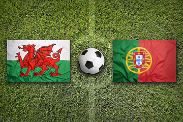 Image showing Wales vs. Portugal flags on soccer field