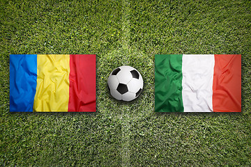 Image showing Romania vs. Italy flags on soccer field