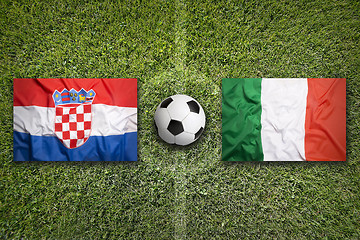 Image showing Croatia vs. Italy flags on soccer field