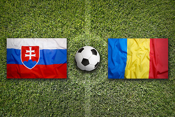 Image showing Slovakia vs. Romania flags on soccer field