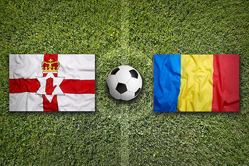 Image showing Northern Ireland vs. Romania flags on soccer field