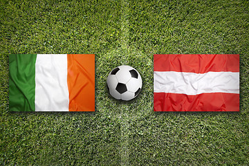 Image showing Ireland vs. Austria flags on soccer field