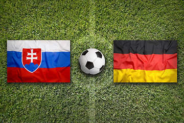 Image showing Slovakia vs. Germany flags on soccer field