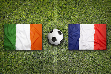 Image showing Ireland vs. France flags on soccer field