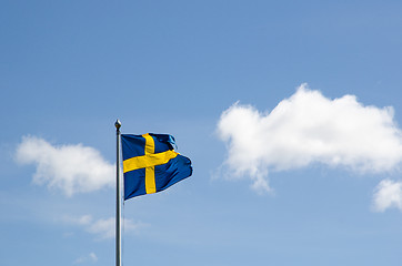 Image showing Swedish flag waving at a summer sky