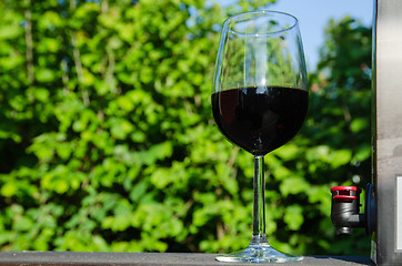 Image showing A glass of red Bag-in-Box wine