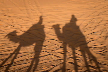 Image showing Camel shadows on Sahara Desert sand in Morocco.