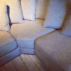 Image showing Comfortable corner sofa with lots of cushions