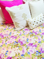 Image showing Bed with colorful floral design bedclothes