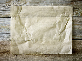 Image showing baking paper sheet on wooden table