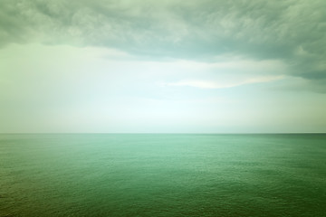 Image showing Moody green sea and clouds