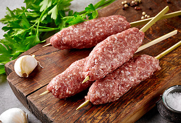 Image showing fresh raw minced meat skewers kebabs