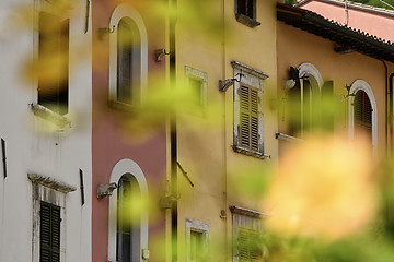 Image showing Houses with blurred flowers