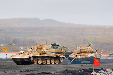 Image showing Armoured recovery vehicle BREM-1M evacuates tank