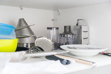 Image showing Various tableware on shelf in the kitchen