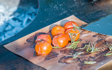 Image showing tomatoes on the grill pan  the table