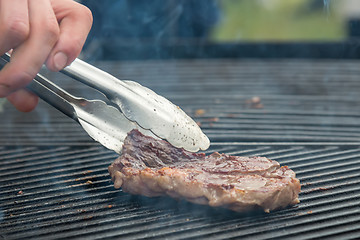 Image showing beef steaks on the grill