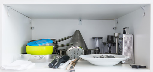 Image showing Various tableware on shelf in the kitchen