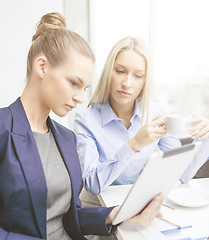 Image showing business team with tablet pc having discussion