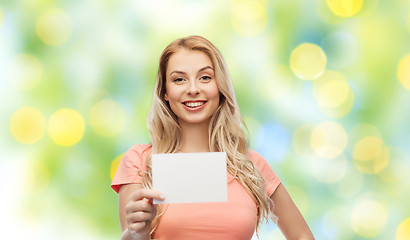 Image showing happy woman or teen girl with blank white paper