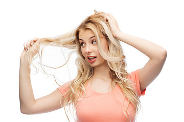 Image showing woman holding strand of her hair