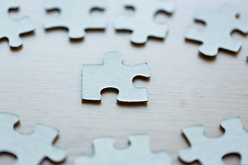 Image showing close up of puzzle pieces on table