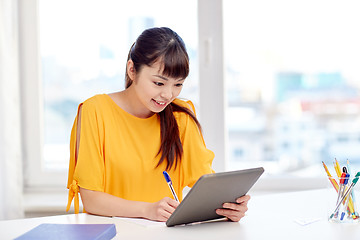 Image showing happy asian woman student with tablet pc at home