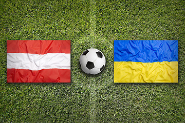 Image showing Austria vs. Ukraine flags on soccer field