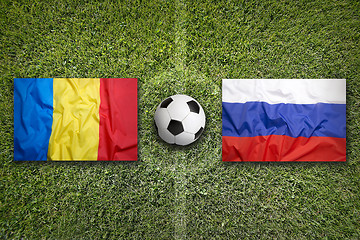 Image showing Romania vs. Russia flags on soccer field