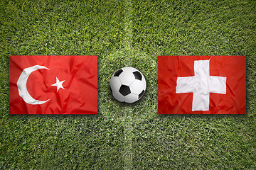 Image showing Turkey vs. Switzerland flags on soccer field