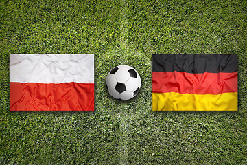 Image showing Poland vs. Germany flags on soccer field