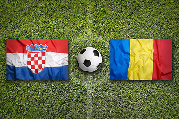 Image showing Croatia vs. Romania flags on soccer field