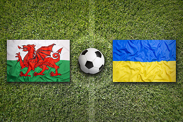 Image showing Wales vs. Ukraine flags on soccer field