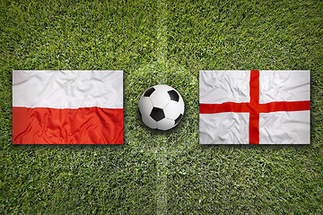 Image showing Poland vs. England flags on soccer field