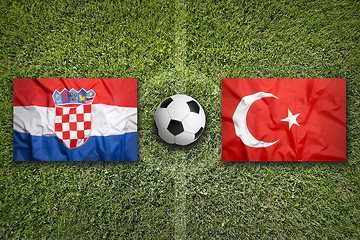 Image showing Croatia vs. Turkey flags on soccer field