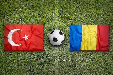 Image showing Turkey vs. Romania flags on soccer field