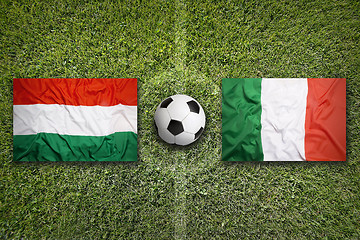 Image showing Hungary vs. Italy flags on soccer field