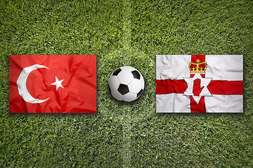 Image showing Turkey vs. Northern Ireland flags on soccer field