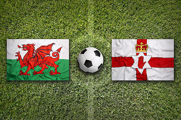 Image showing Wales vs. Northern Ireland flags on soccer field