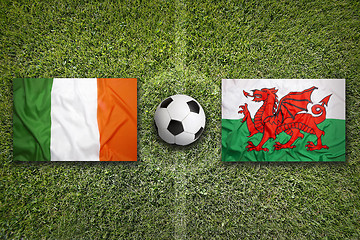 Image showing Ireland vs. Northern Ireland flags on soccer field