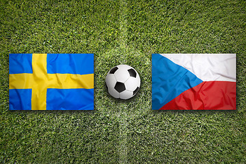 Image showing Sweden vs. Czech Republic flags on soccer field