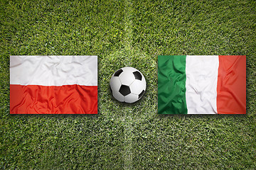 Image showing Poland vs. Italy flags on soccer field