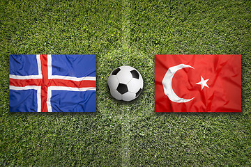 Image showing Iceland vs. Turkey flags on soccer field