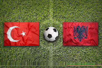 Image showing Turkey vs. Albania flags on soccer field