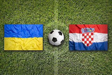 Image showing Ukraine vs. Croatia flags on soccer field